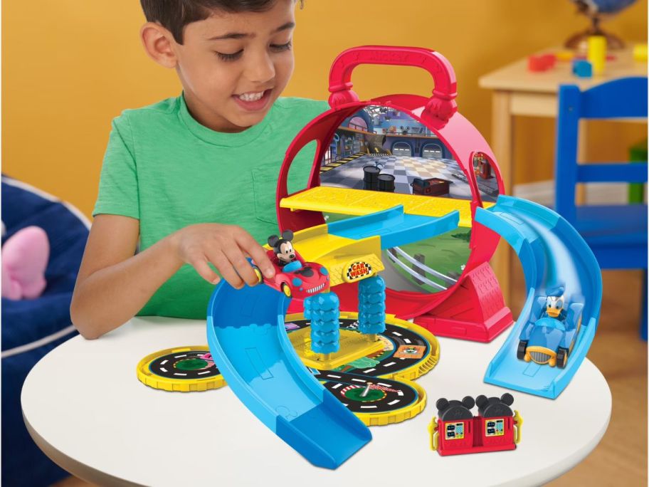 kid playing with Disney Junior Mickey Mouse Stow &rsquo;n Go Garage