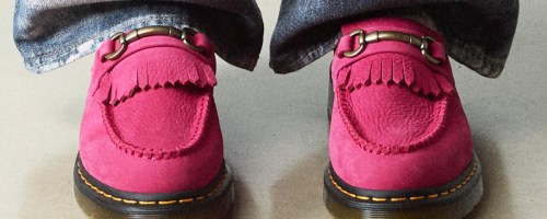 person wearing bright pink loafers