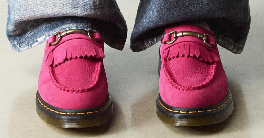person wearing bright pink loafers