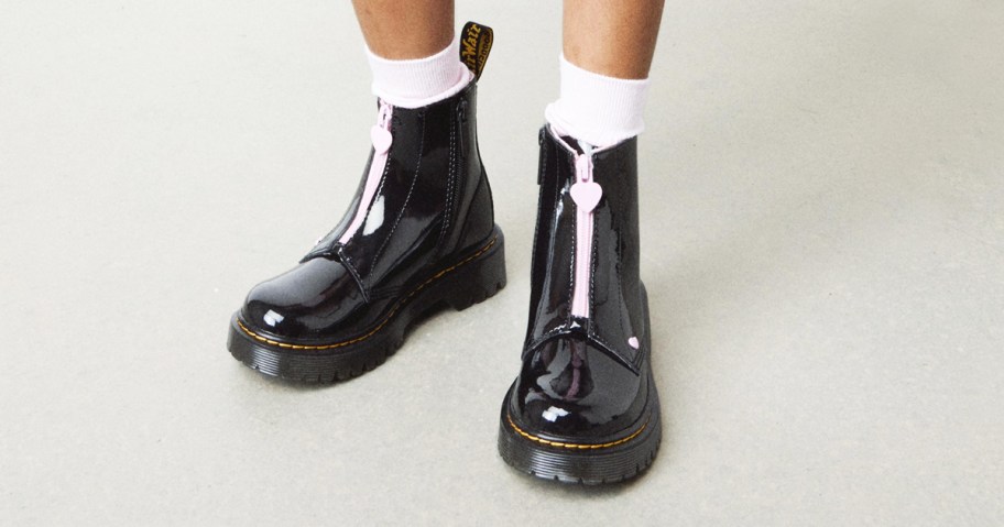girl wearing black patent leather boots