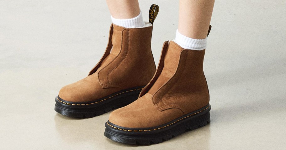 person wearing tan laceless boots