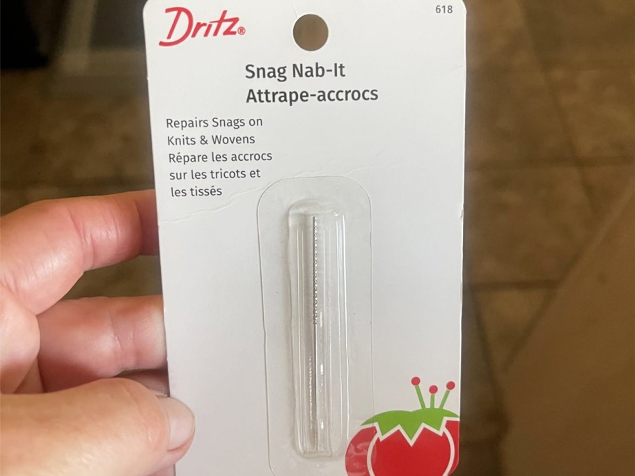 hand holding Dritz Snag Nab-It Snag Repair Tool