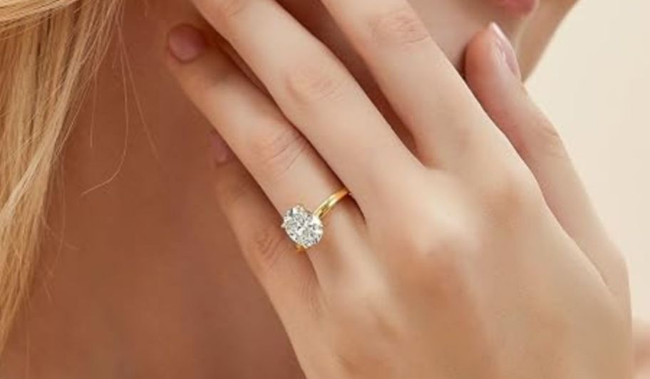 hand wearing EAMTI Engagement Rings
