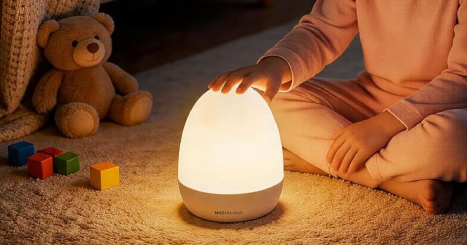 child touching a MediAcous Egg Night Light