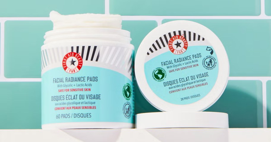 two jars of First Aid Beauty Facial Radiance Pads on a bathroom shelf