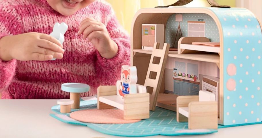 kid playing with Fisher-Price Fisher-Price Wood Pretend Play Toy Dollhouse