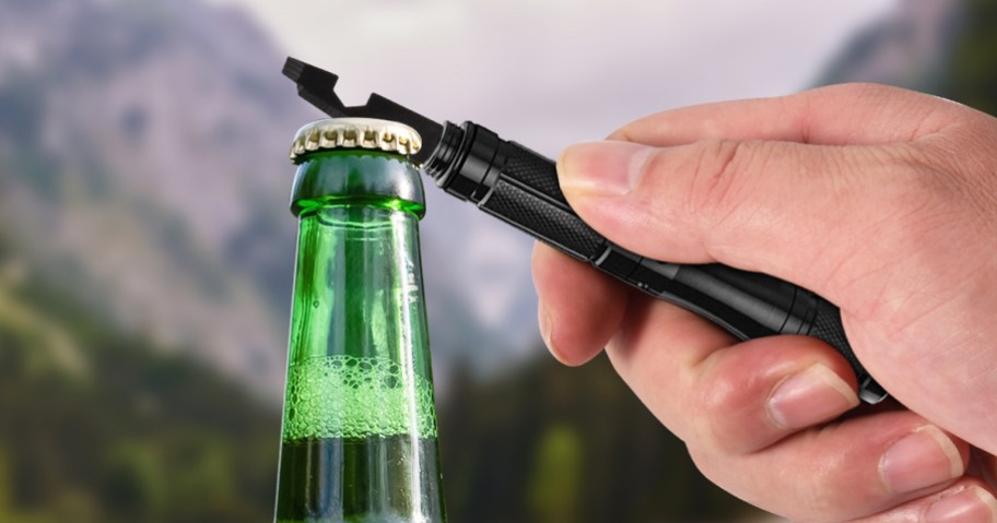 opening a glass bottle with a multi-tool pen