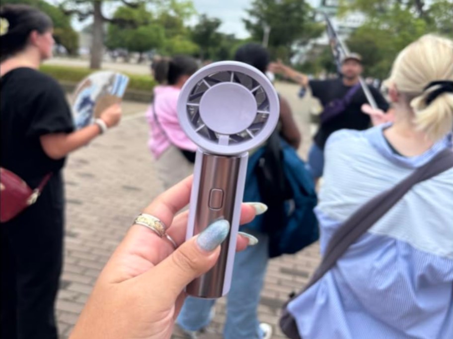 purple Gaiatop Small Handheld Fan in hand