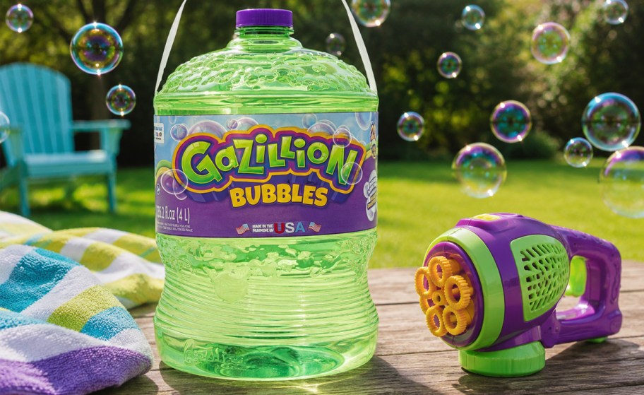 bottle of Gazillion Bubbles near a bubble blower on a table outside
