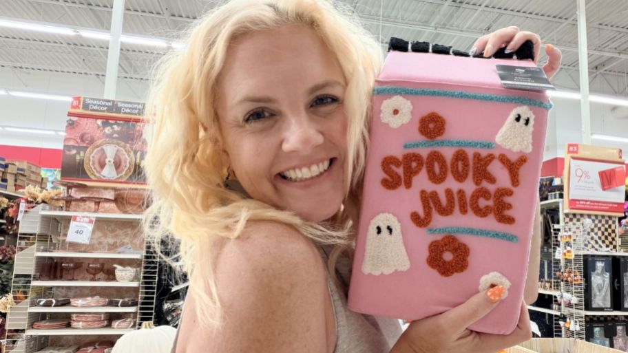 Woman holding Spooky juice halloween throw pillow