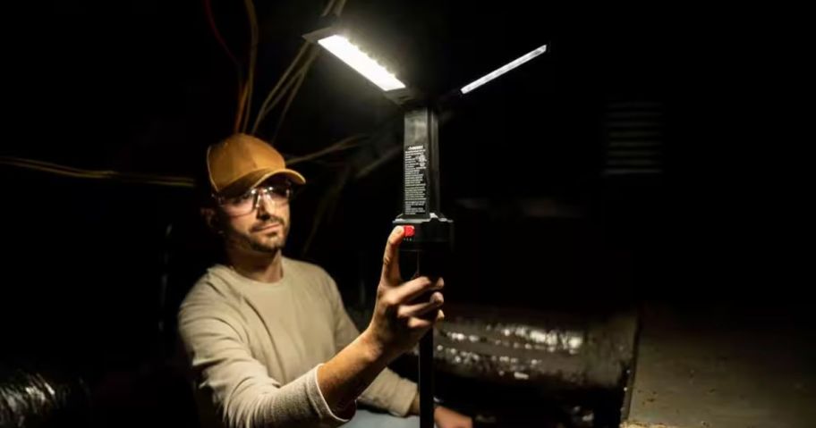 Man using a Husky Rechargeable Work Light