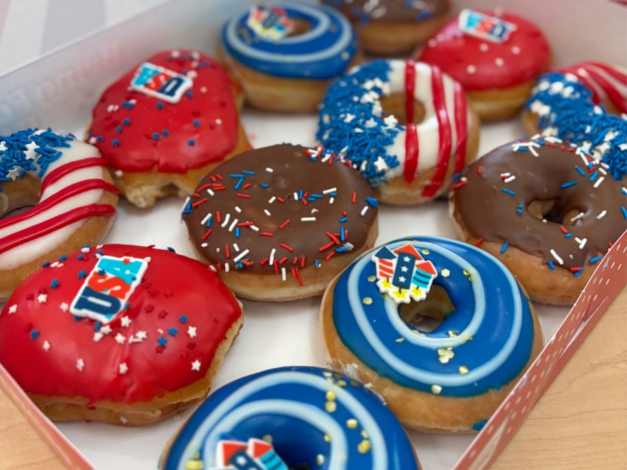 dozen patriotic decorated doughnuts in a box