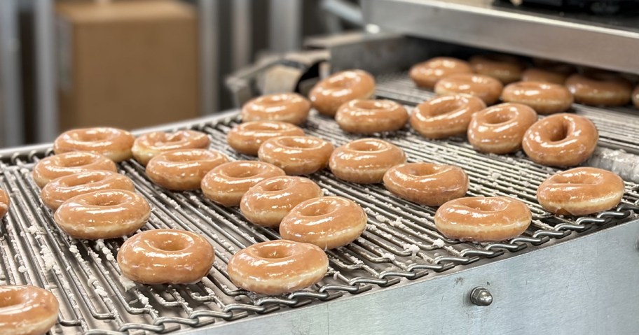 glazed doughnuts on conveyor belt