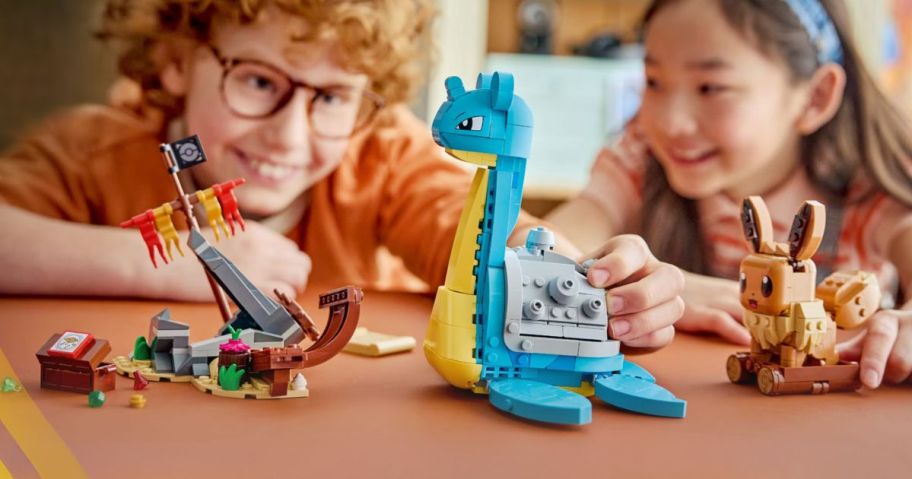 kids playing with LEGO Pokémon SMART Play: Eevee & Lapras's Treasure Hunt