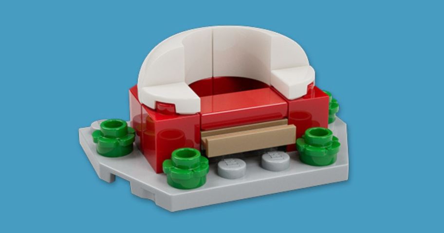 LEGO Stadium model against blue background