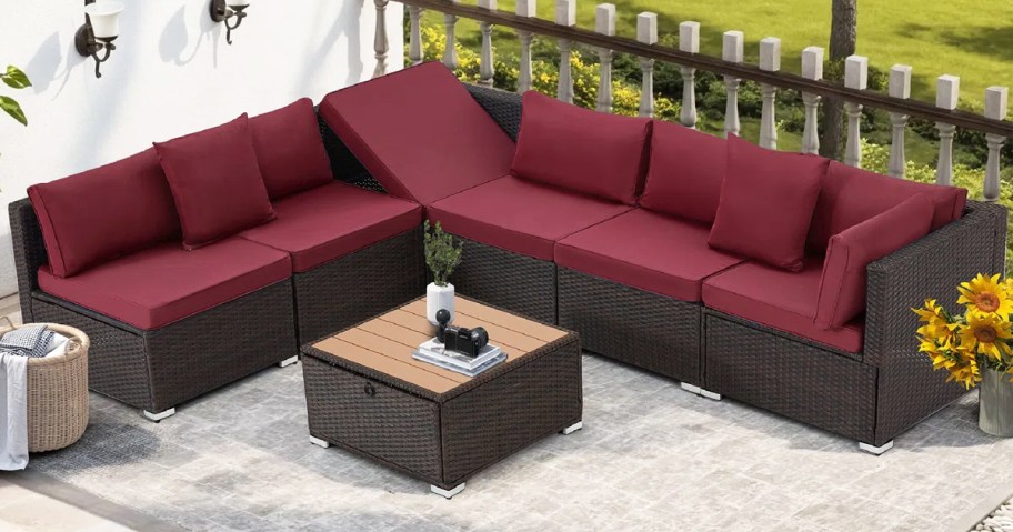 wicker sectional with maroon cushions and square coffee table