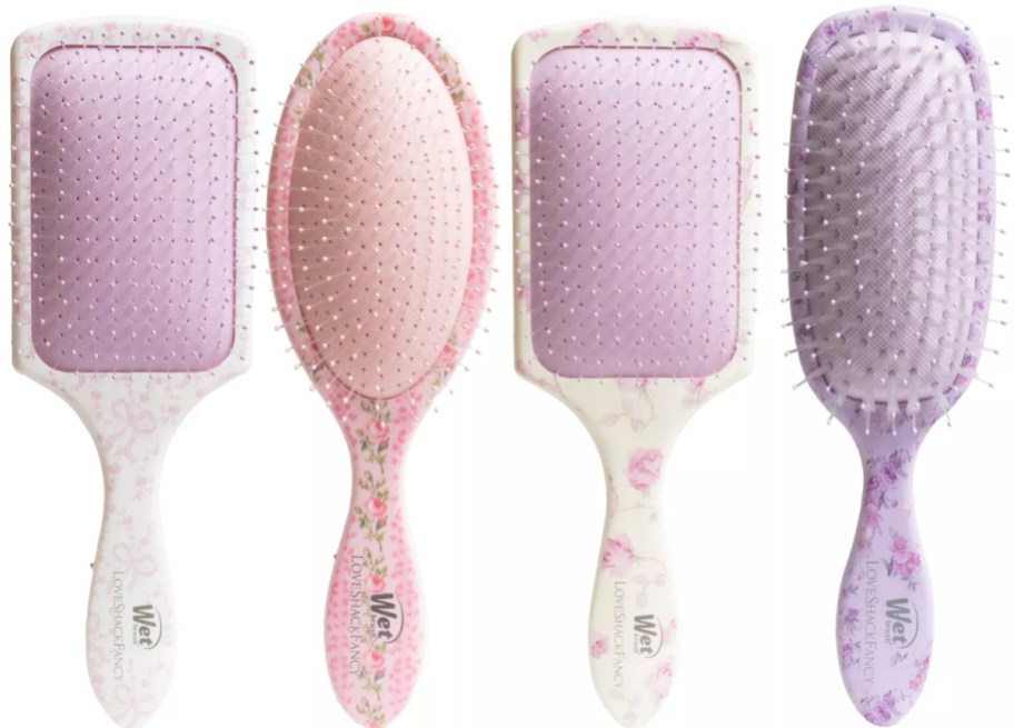 Four pastel floral Wet Brush hairbrushes side-by-side.