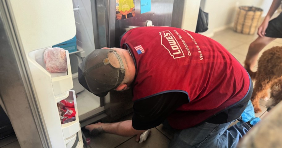 Lowe's employee in-home replacing refrigerator filter