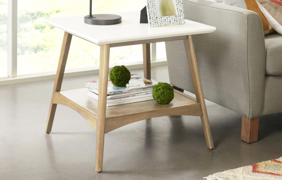 wood side table next to a couch