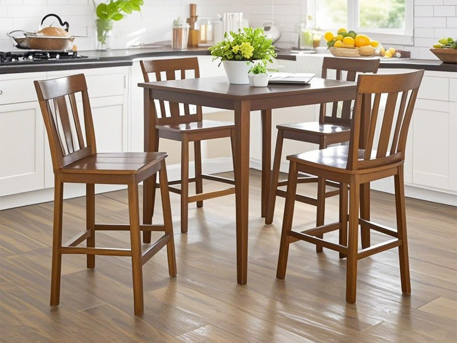 matching wood dining table and chairs in a kitchen