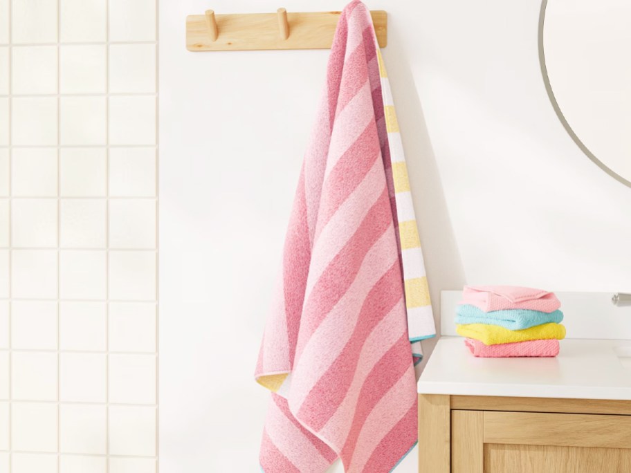 pink striped towel hanging in a bathroom