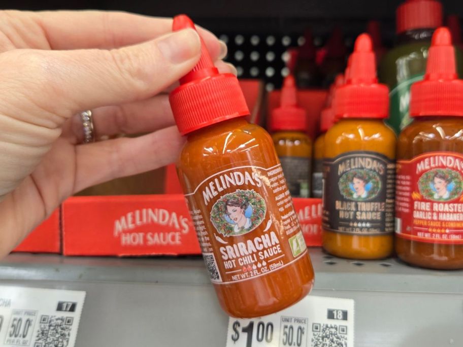 Melinda's Foods Sriracha Hot Chili Sauce in hand in store
