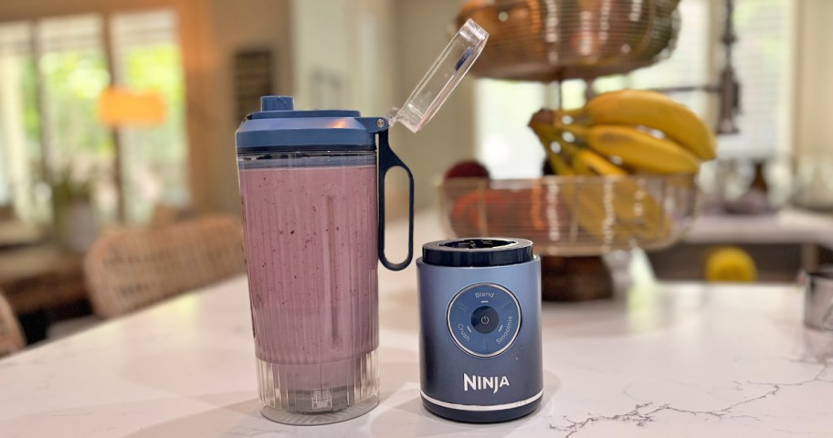 blue ninja personal blender on counter with smoothie inside