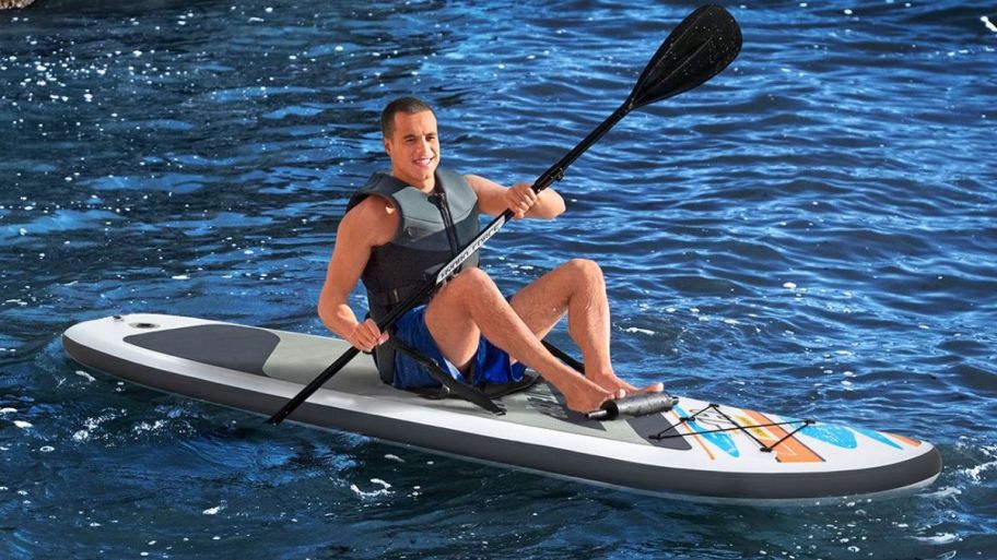 Paddle board with person on it