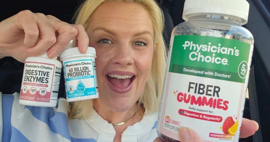 Woman holding bottles of Physician's Choice supplements & probiotics