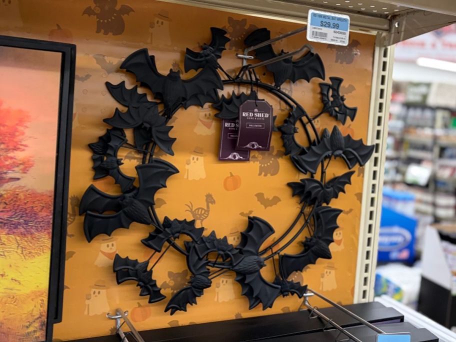 Red Shed 18" Metal Bat Wreath hanging in store