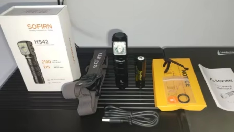 rechargeable headlamp with accessories including charging cable and head strap