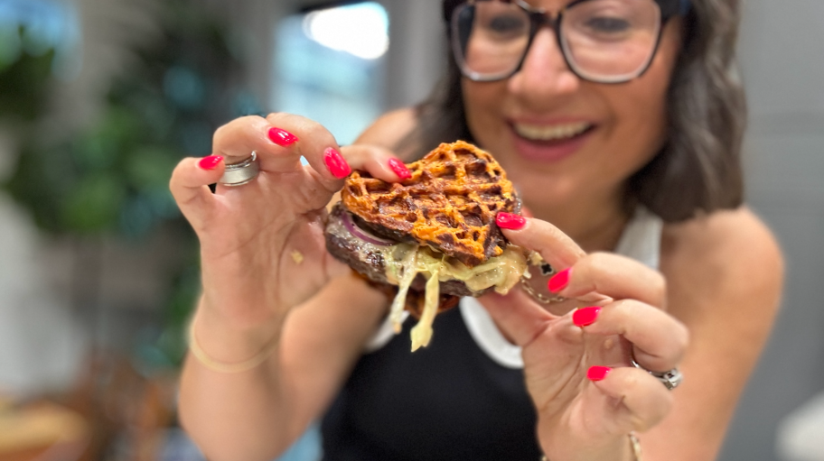 holding a sweet potato waffle