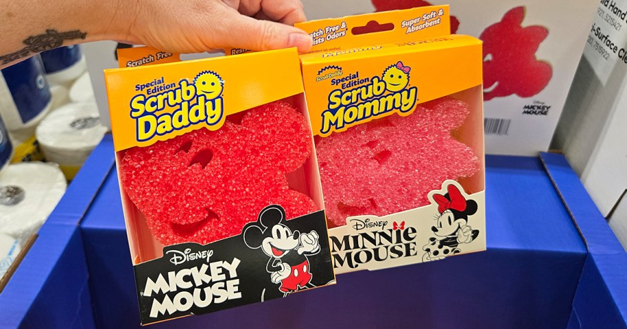 hand holding up Scrub Daddy Disney Mickey & Minnie Mouse Sponges