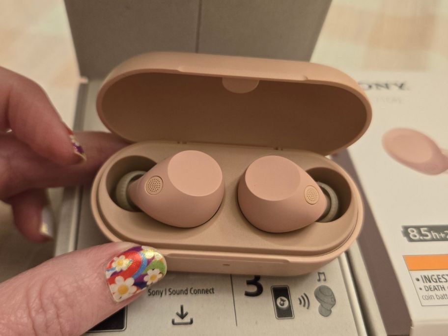 pink Sony WF-C710N Truly Wireless Noise Canceling Earbuds in hand