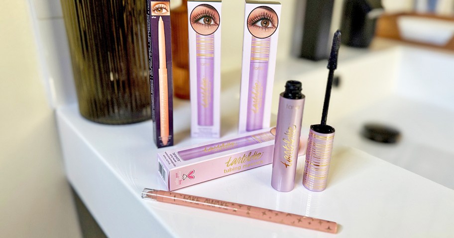 two tarte mascaras an eyeliner on bathroom counter