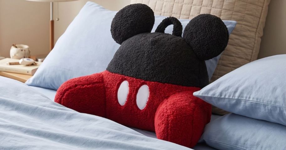 The Big One Disney Backrest Pillow in Mickey Mouse on bed