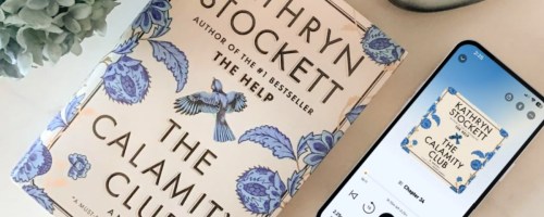 The calamity Club book on countertop next to Phone with Audible version