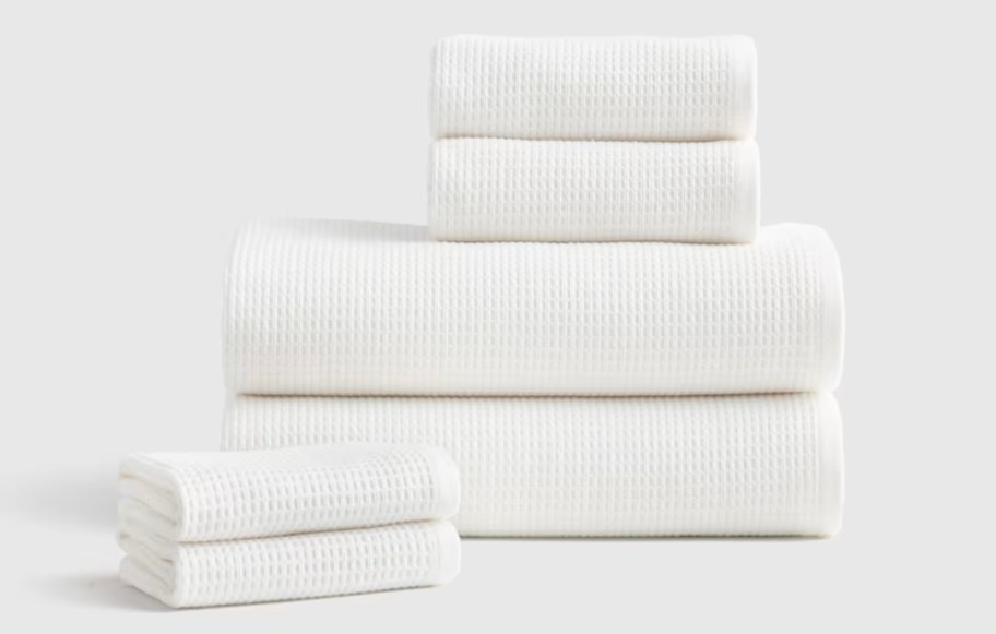stack of white bath towels