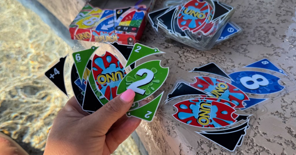 Hand holding Uno waterproof card game