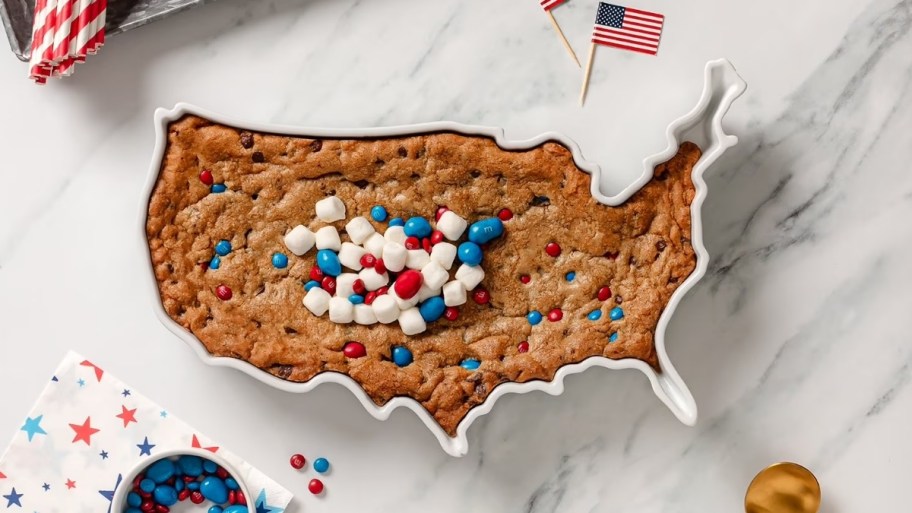 a usa-shaped baking dish with an m&m's cookie baked inside. 