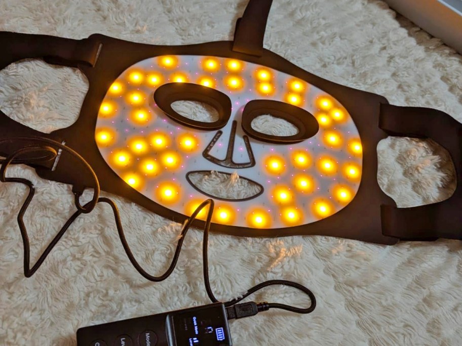 led lights on red light therapy mask glowing yellow