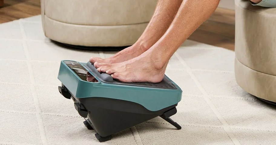 person with their feet on a foot massager