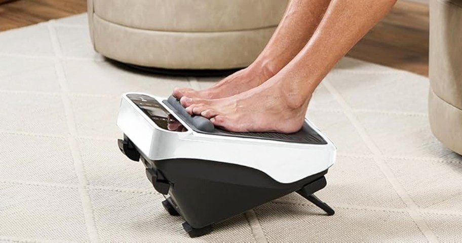 person with their feet on a foot massager