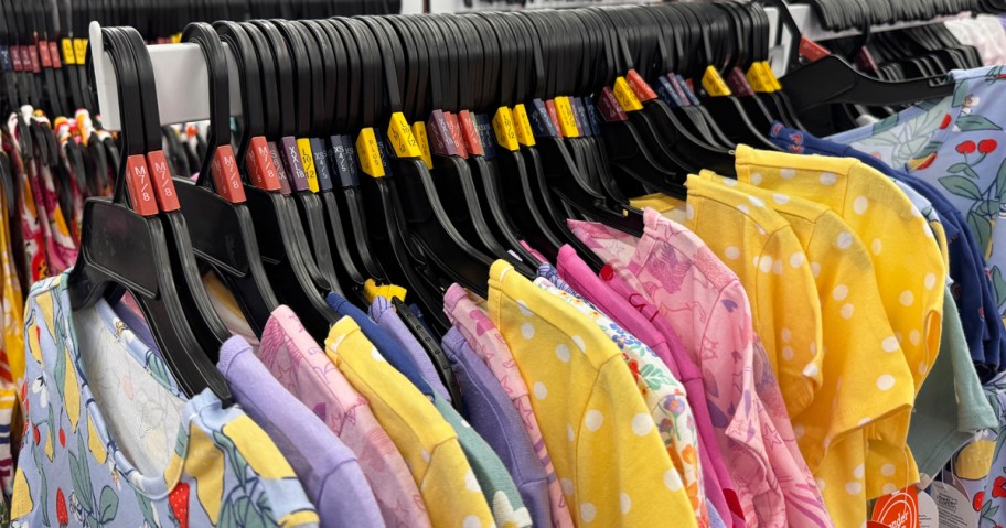 kids clothing on hangers on store display rack