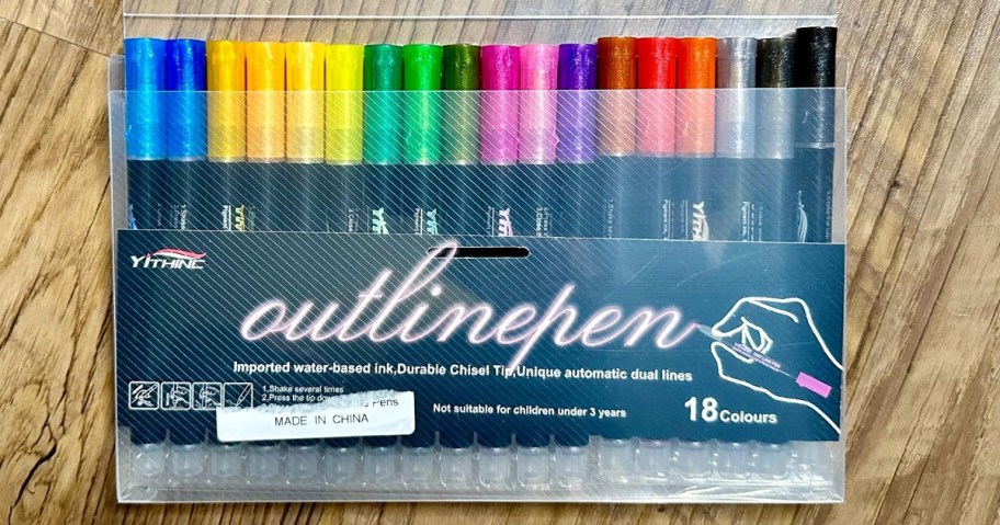 colorful set of markers on a wood table