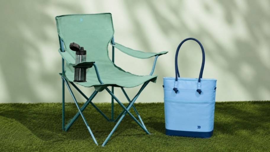 a green camp chair abnd blue soft-sided cooler tote