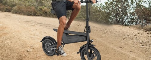 man riding black ebike