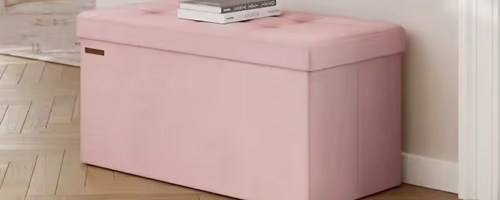 pink storage bnech with book on top