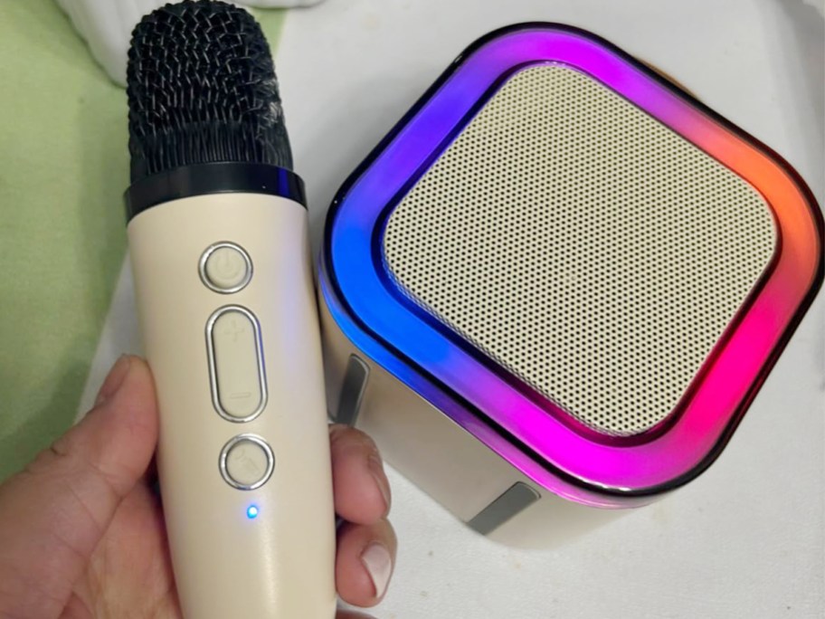 white karaoke machine with mic