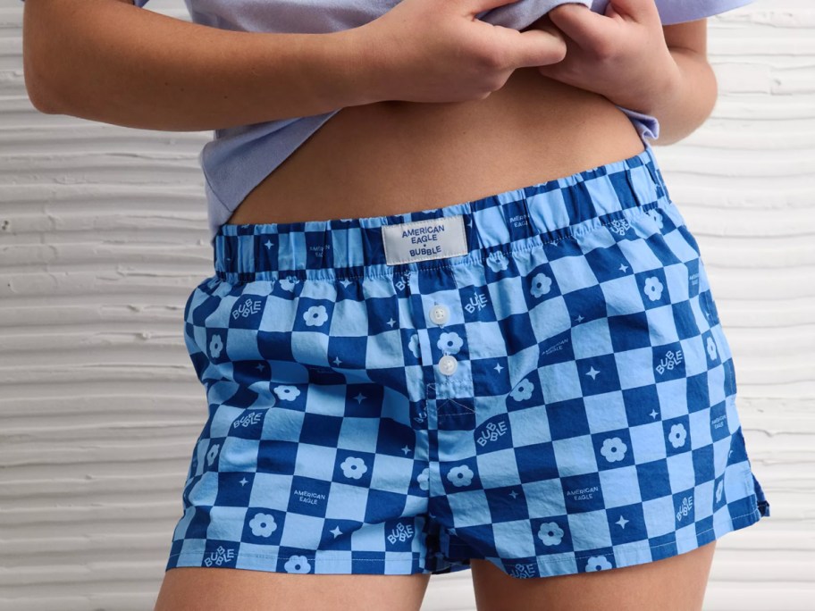 girl in blue checkered shorts